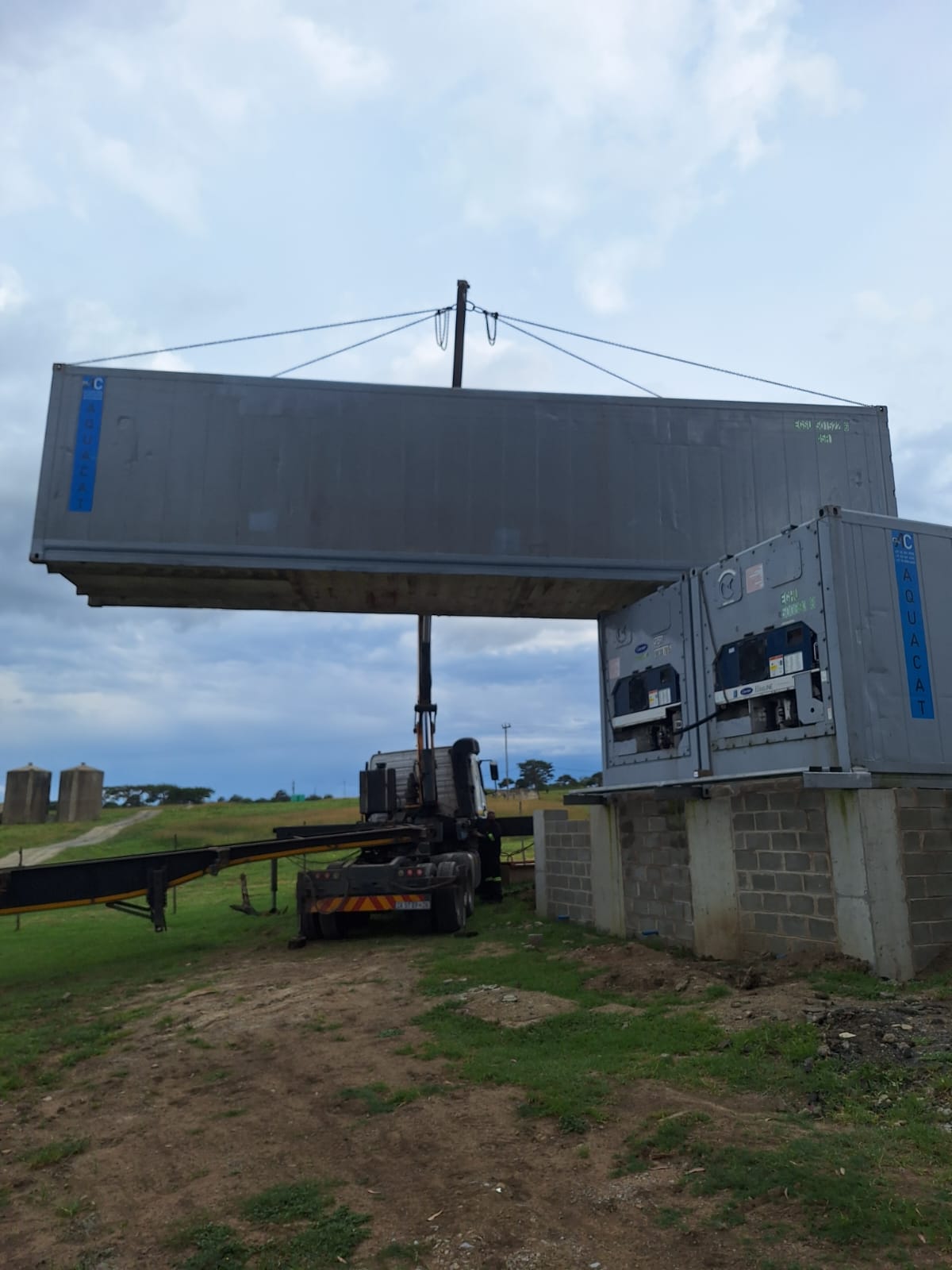 Crane lifting AquaCat reefer container on site in KwaZulu-Natal