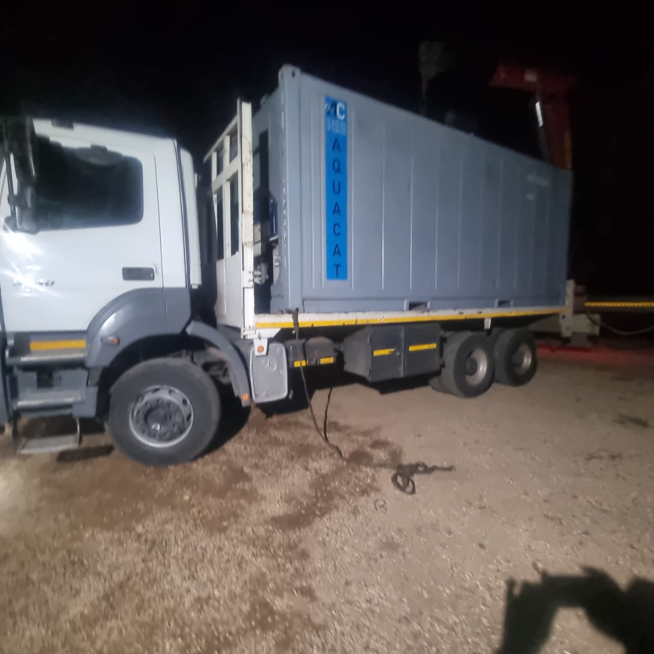 AquaCat reefer container loaded on truck for night delivery