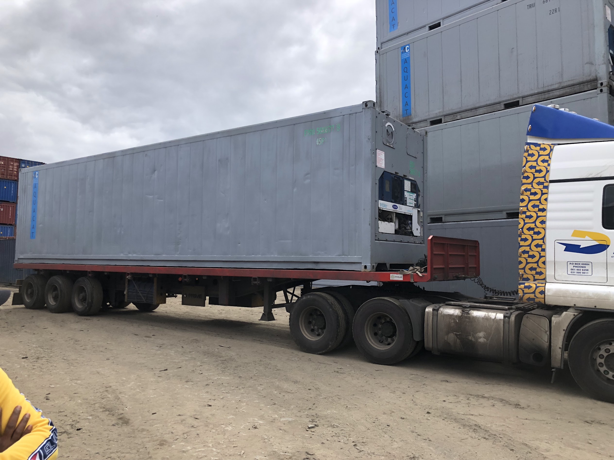 AquaCat reefer container on flatbed trailer for distribution delivery